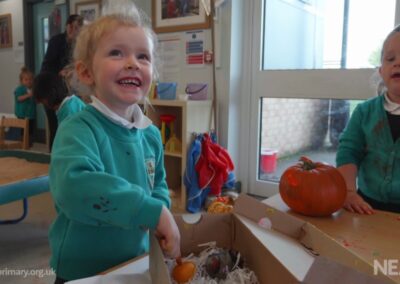 Children playing together in a bright nursery classroom at Whitehouse Primary School, North Shields.